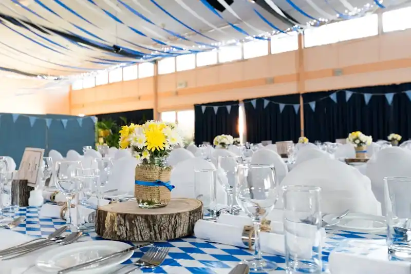 Elegant wedding reception table with floral centerpieces and candlelight